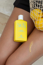 Load image into Gallery viewer, Goldie Shimmer Oil on legs with lemons